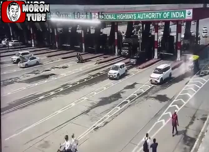 Video :An employee is attempted to be ran over by a car who avoids a toll booth